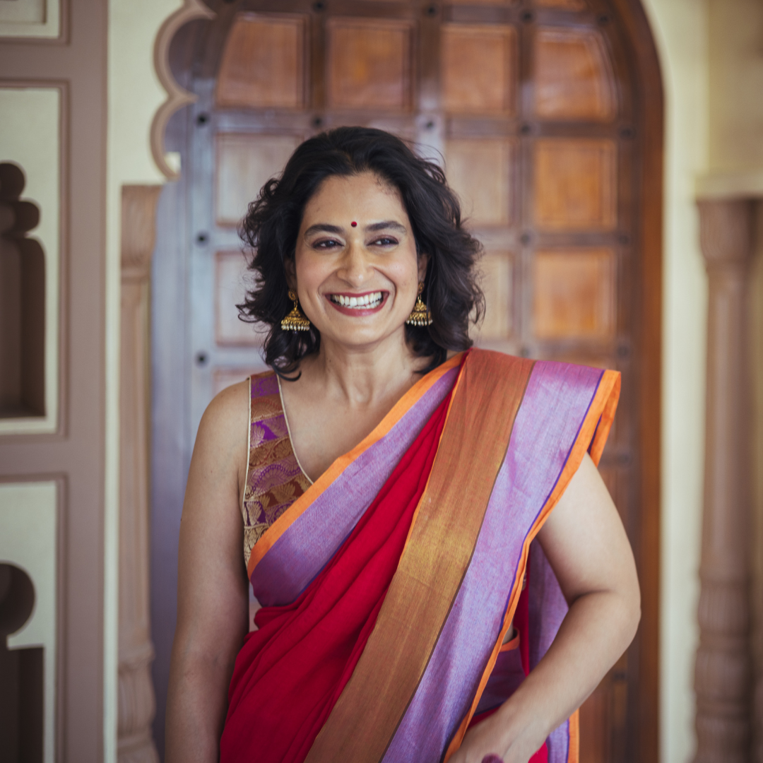 Handloom artisan weaving intricate cultural patterns into a traditional saree