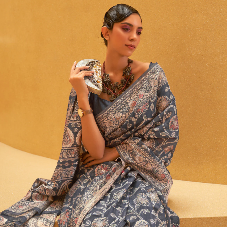Woman wearing traditional Chikankari saree with intricate white embroidery